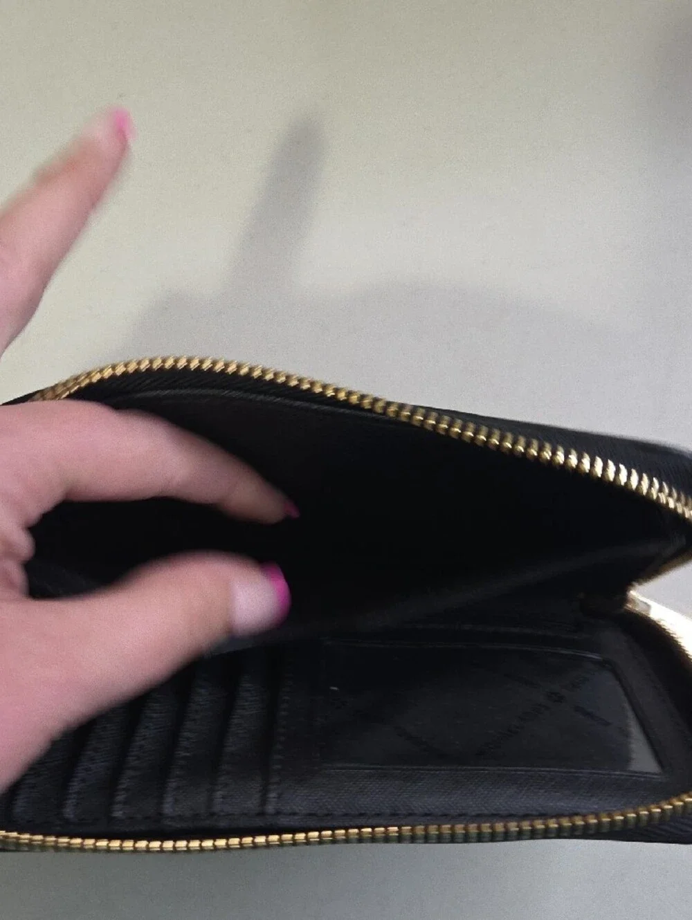Michael Kors Black Leather Zip-Around Wallet with Floral Emboss and Gold Logo